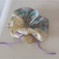 Gifty checkered bow ribbon scrunchie on a wooden surface