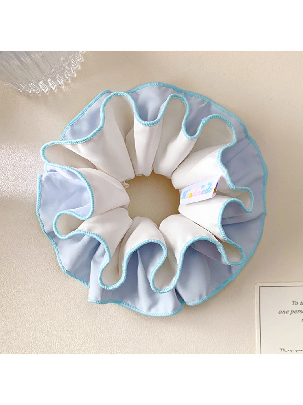 Minimalist blue double layer scrunchie on a white background