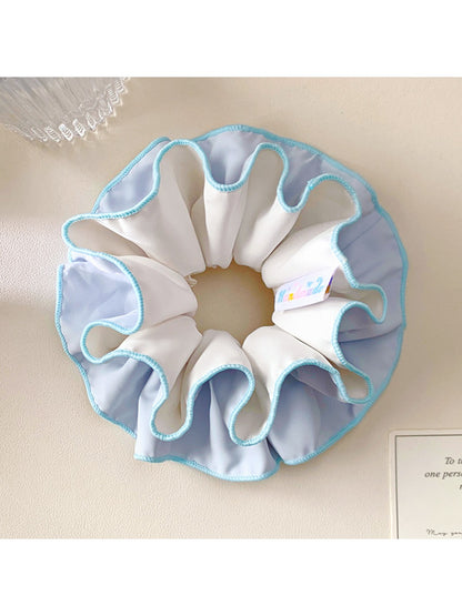 Minimalist blue double layer scrunchie on a white background