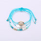 Lovra mermaid tail bracelet worn on wrist showing bead and charm details