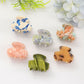 Beau fresh acetate hair clip held in hand displaying size and shape