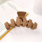 Beau minimalist modern wavy hair claw clip angled to show thickness and curves