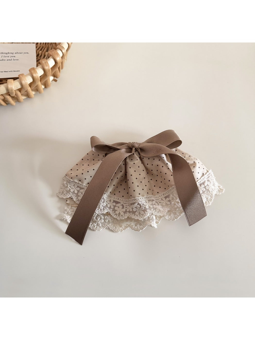 Close-up of Beau Polka Dot Lace Scrunchie fabric texture and lace detailing
