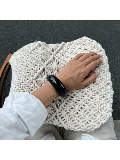 Lovra open cuff ring worn on finger with soft natural light