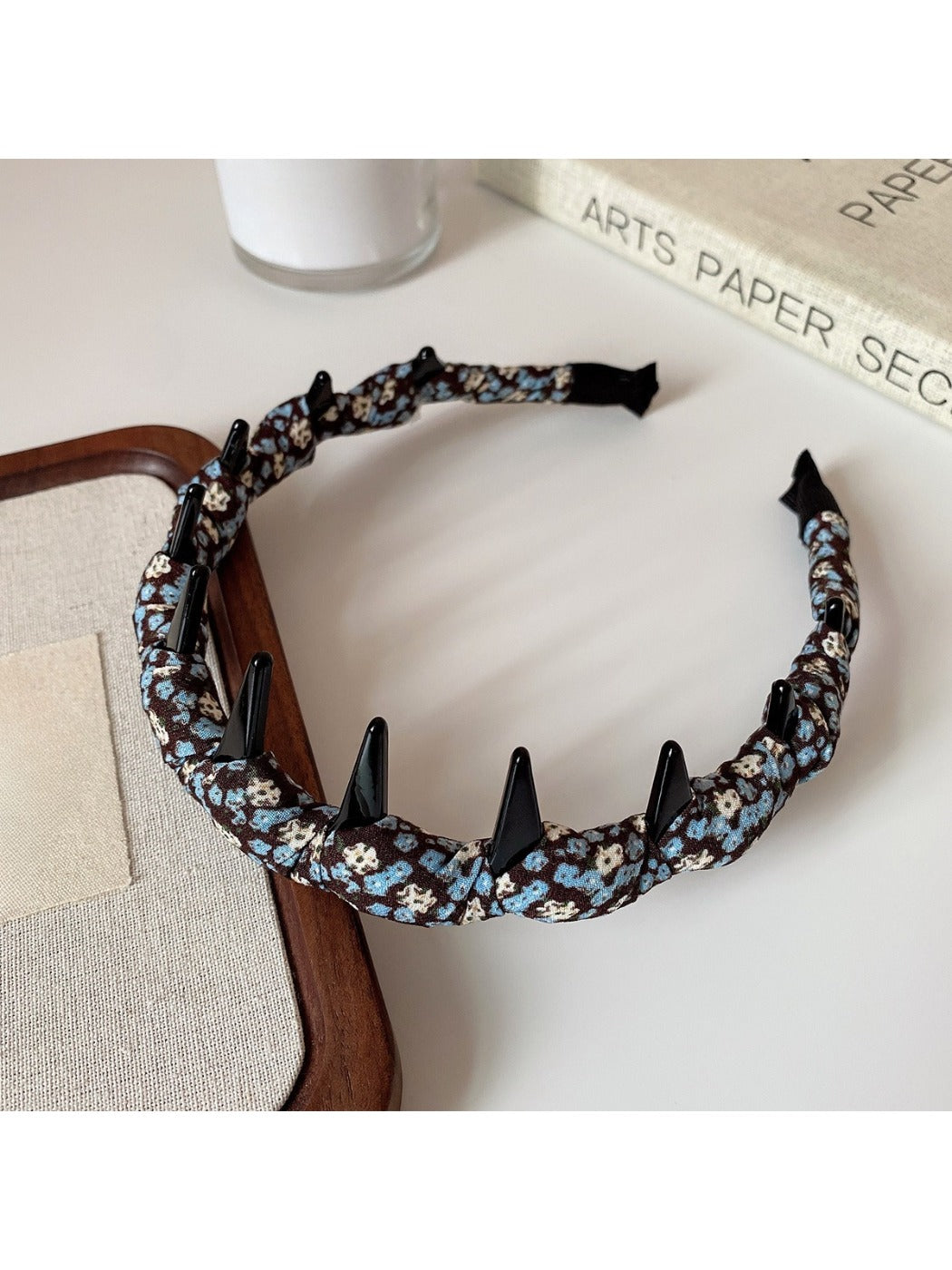 Floral headband displayed on white background showing full shape