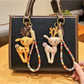Close-up of a stylish deer charm keychain with intricate antler design