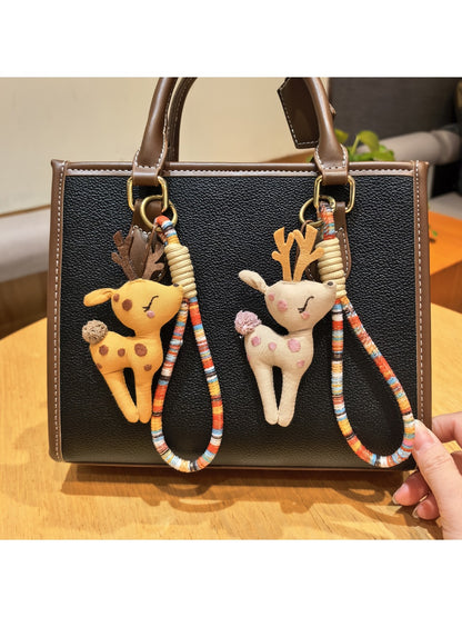 Close-up of a stylish deer charm keychain with intricate antler design