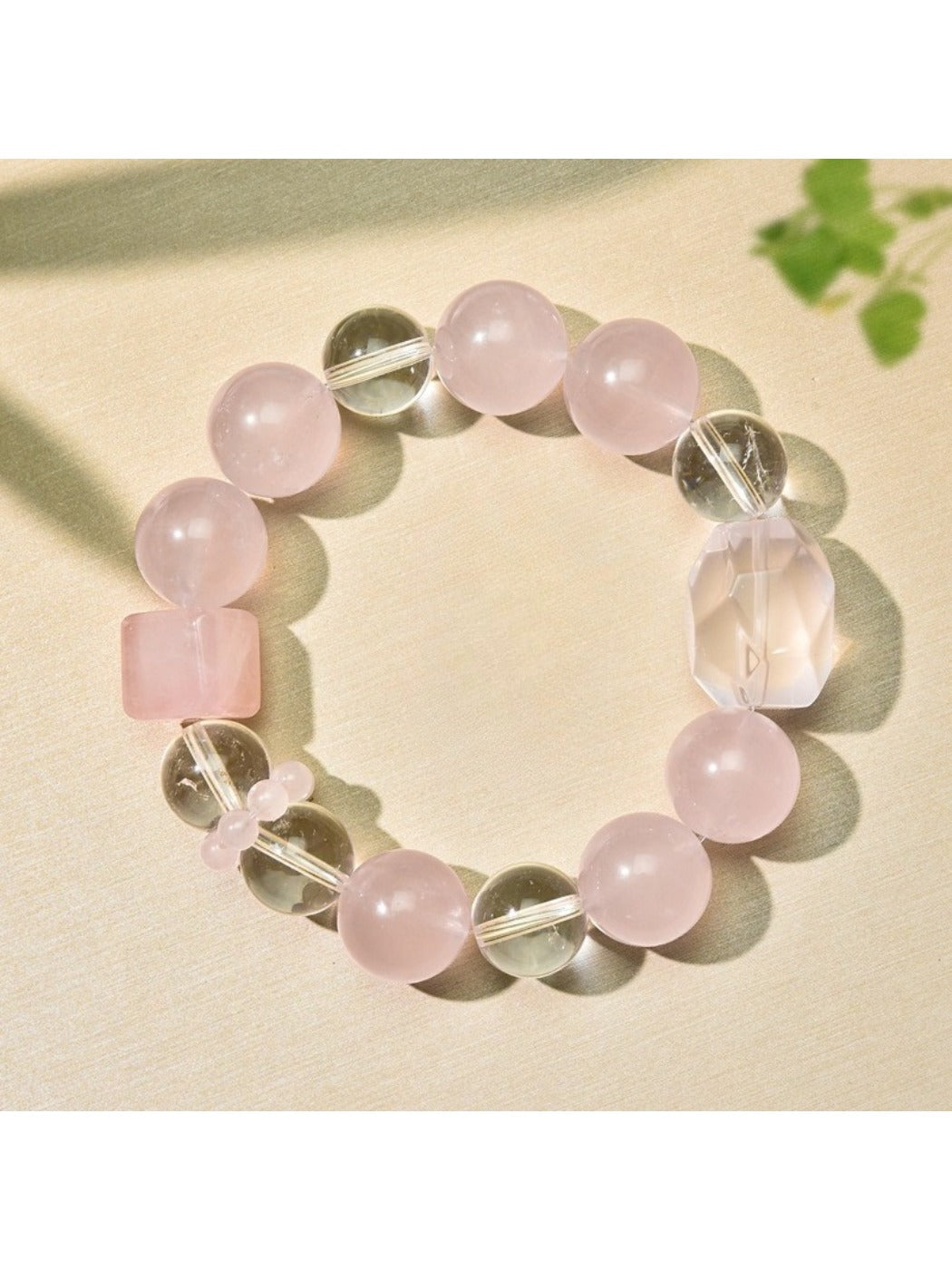 Lovra pink beaded bracelet worn on wrist showing delicate design and gold accents