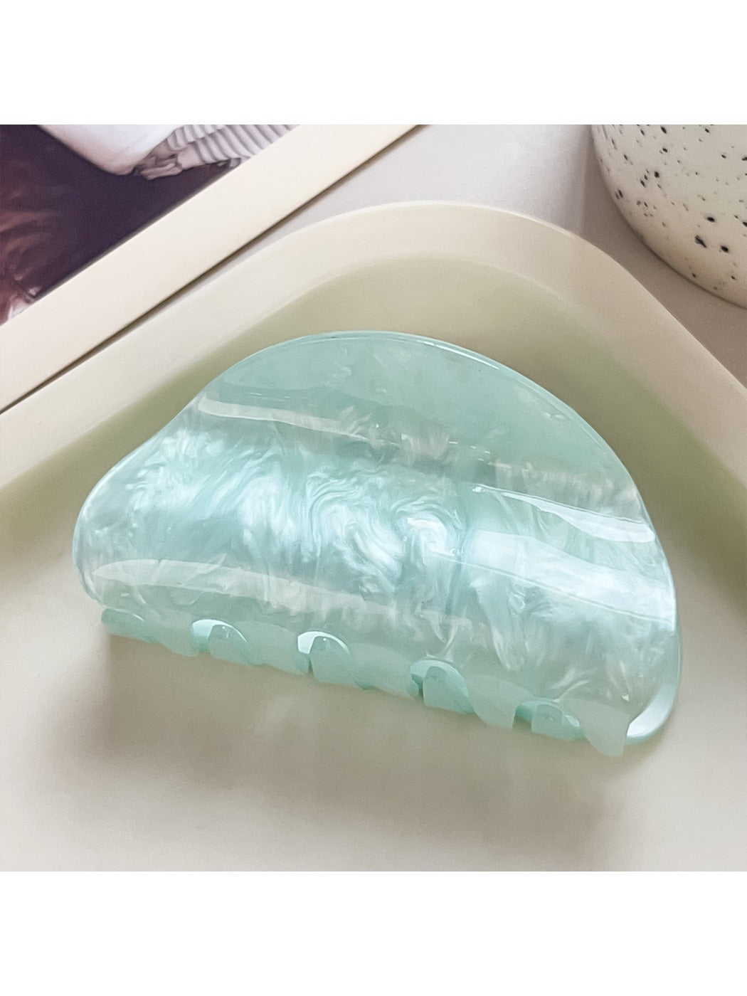 Beau claw clip shown from bottom angle highlighting clip teeth