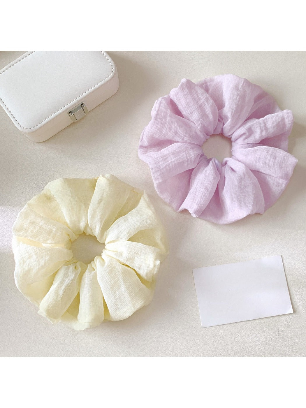 Close-up of vibrant, multicolored scrunchie showing fabric texture