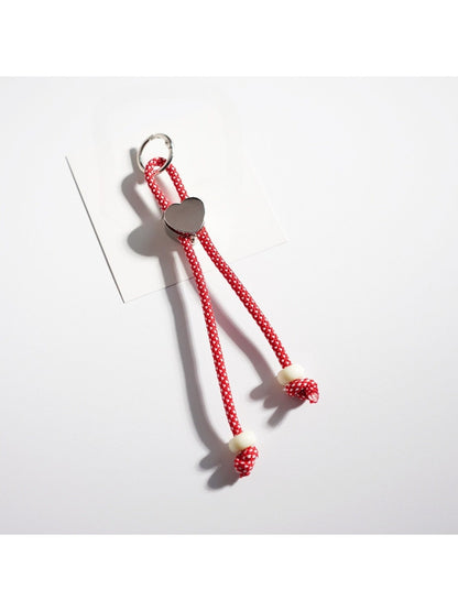Rope heart keychain with vibrant colors against a plain background