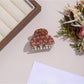 Beau leopard print hair clip shown in packaging with brand label