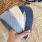 Close-up of Gifty solid color headband with diamond pattern in soft fabric