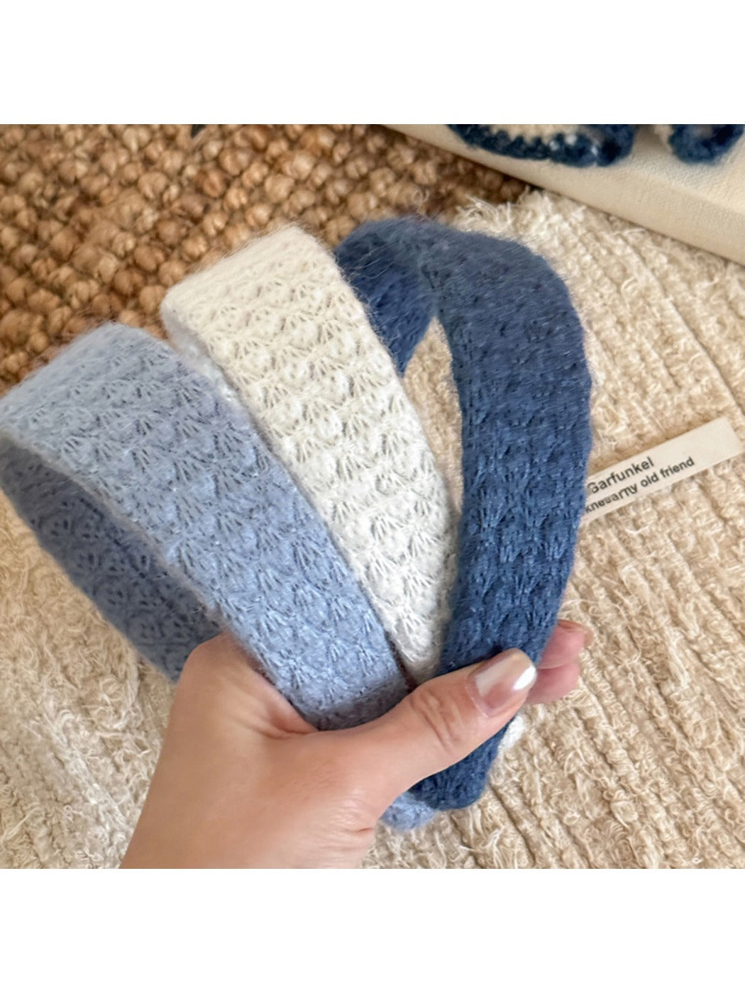 Close-up of Gifty solid color headband with diamond pattern in soft fabric