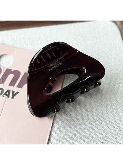 Beau claw clip in use, securing medium-length hair from the back