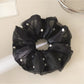 Gifty chic tulle scrunchie paired with casual outfit for a stylish look