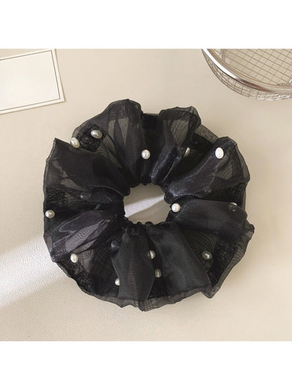 Gifty chic tulle scrunchie paired with casual outfit for a stylish look