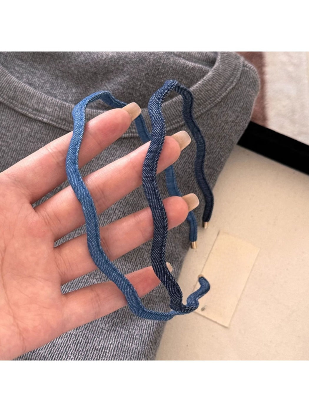 Close-up of denim fabric texture on the wave headband