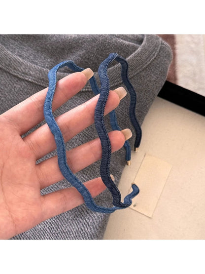 Close-up of denim fabric texture on the wave headband