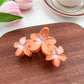 Beau Sweet Three Flower Hair Claw Clip displayed with flowers for aesthetic