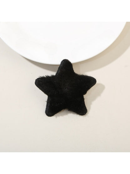 Top view of plush star hair clip highlighting its symmetrical five-point design
