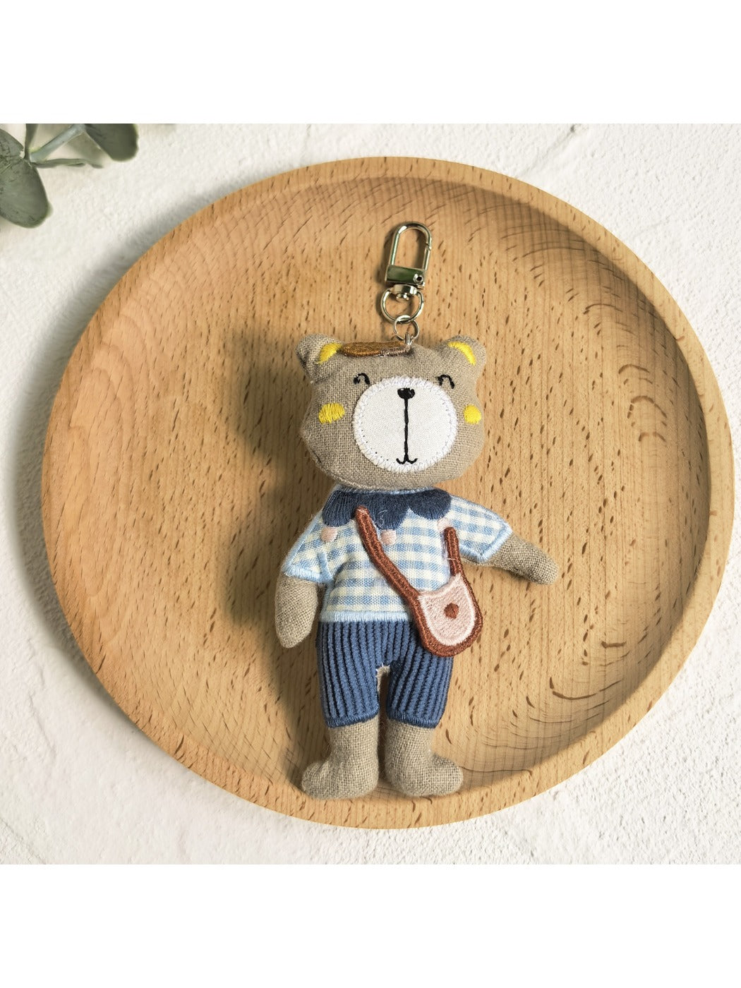 Bear charm keychain displayed on a white background with soft shadows