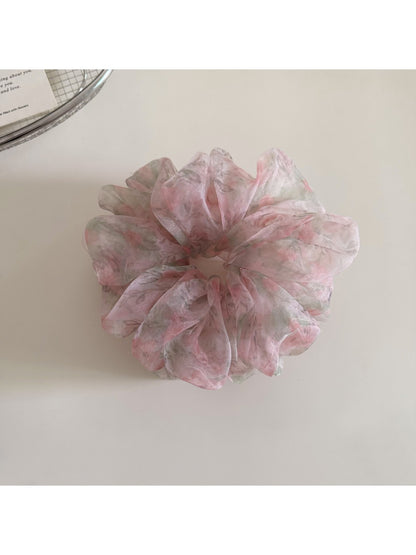 Gifty ditsy floral print hair scrunchie displayed flat with detailed flower pattern
