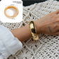 Lovra wide fit bracelet styled with casual clothing on model's arm