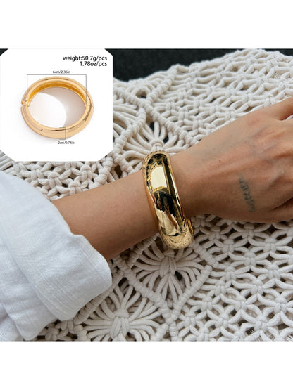 Lovra wide fit bracelet styled with casual clothing on model's arm