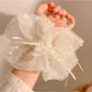 Close-up of white double layer scrunchie showing fabric texture and stitching details