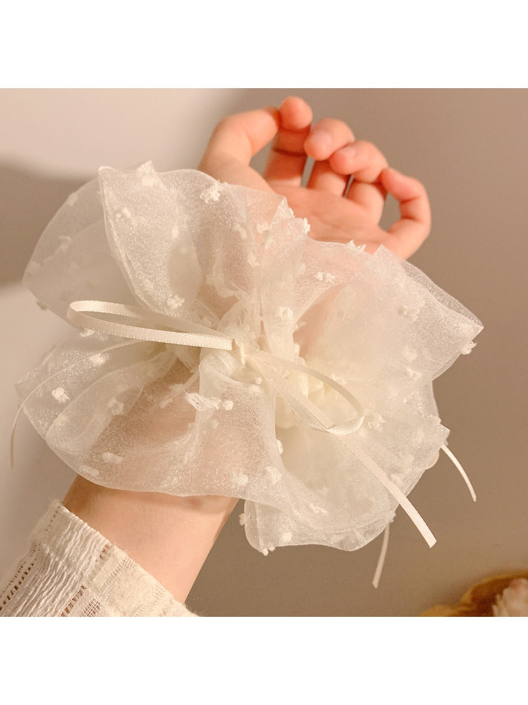 Close-up of white double layer scrunchie showing fabric texture and stitching details