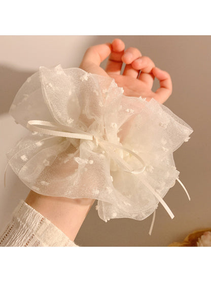 Close-up of white double layer scrunchie showing fabric texture and stitching details