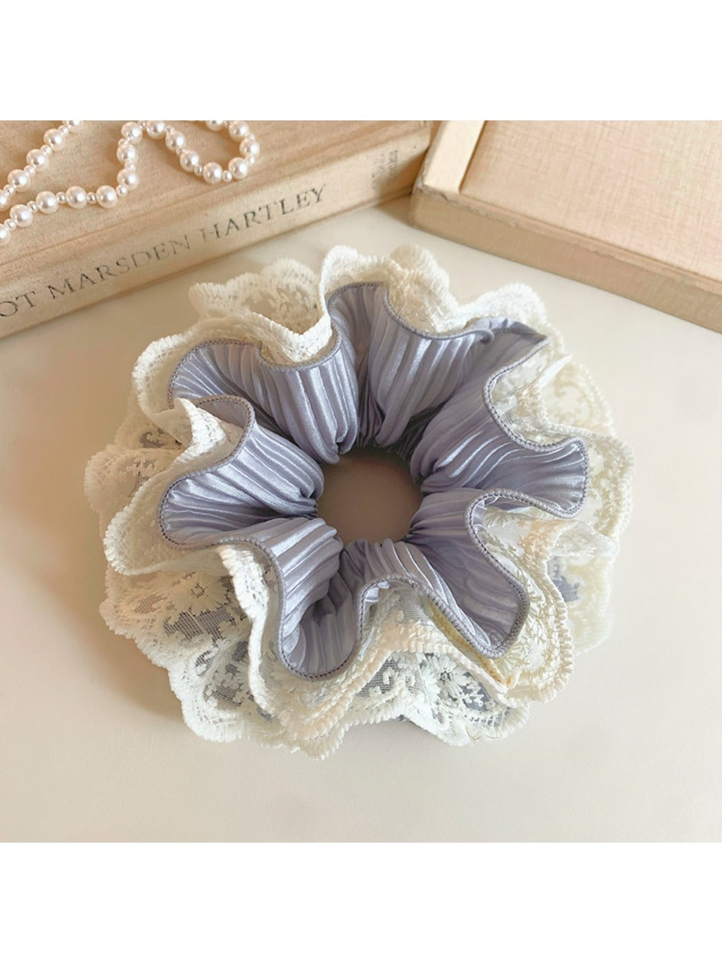 Gifty double layer ruffled scrunchie styled in a ponytail on a model with brown hair