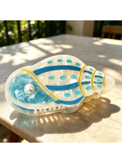 Beau claw clip in pastel green with sea animal design displayed flat