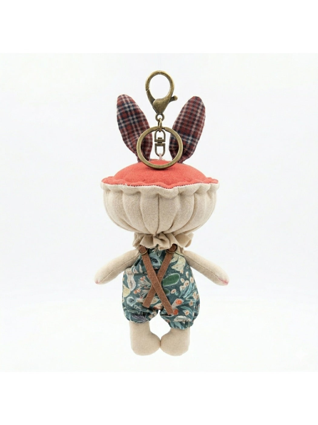 Keypus fabric doll keychain showing colorful embroidered details on the outfit