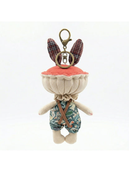 Keypus fabric doll keychain showing colorful embroidered details on the outfit