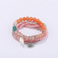 Lovra delicate beaded bracelet held in hand showing clasp and beads