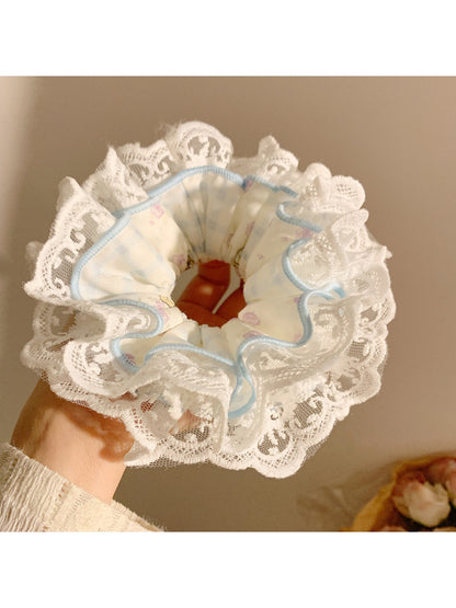 Side view of Gifty printed scrunchie showing gathered fabric texture and pattern