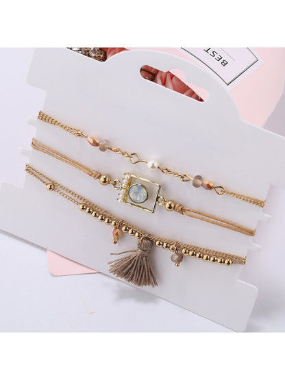 Lovra bracelet with tassel pendant and small beads arranged in a circle