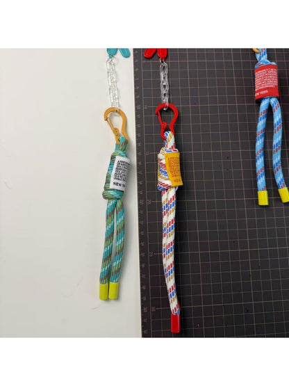 Close-up of the retractable cord mechanism on the colorful keychain