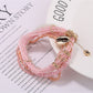 Detailed shot of Lovra bracelet beads in various bright colors and sizes