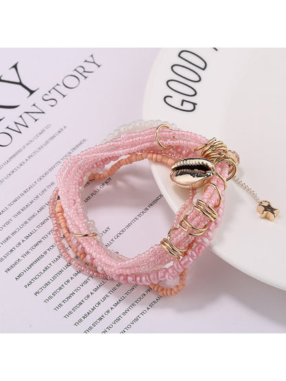 Detailed shot of Lovra bracelet beads in various bright colors and sizes