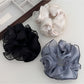 Close-up of Gifty double layer satin ruched scrunchie in soft pink