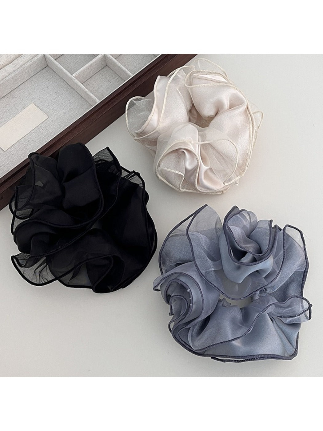 Close-up of Gifty double layer satin ruched scrunchie in soft pink