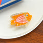 Beau tropical fish acetate hair clip with visible metal clasp on the back