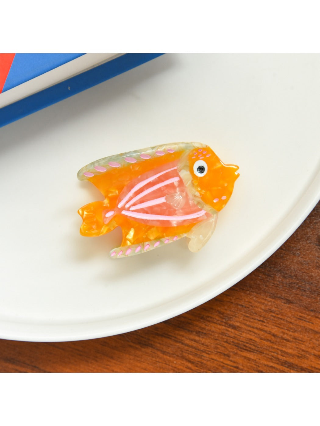 Beau tropical fish acetate hair clip with visible metal clasp on the back
