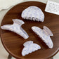 Beau blue floral print hair claw clip on white background showing front view