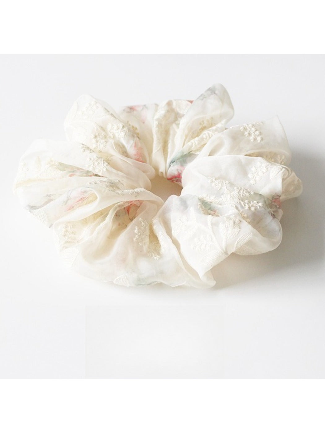 Gifty scrunchie laid flat to showcase full printed fabric and ruched design