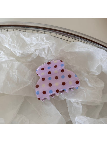 Beau pink polka dot hair clip styled in a ponytail