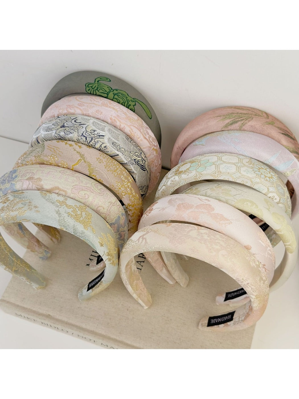 Side view of Gifty fabric embroidered flower headband showing detailed stitching